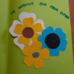 kartka okolicznościowa z trzema kwiatkami i napisem w języku niemieckim